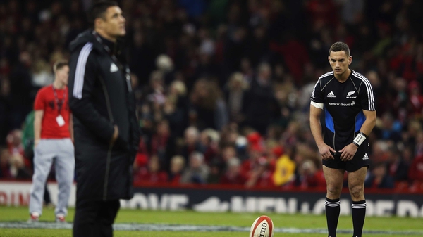Injured Daniel Carter looks on as Aaron Cruden warms up before the match at the Millennium Stadium
