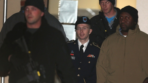 Bradley Manning is escorted from a military court hearing