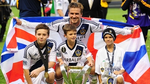 David Beckham celebrates with his three sons following LA Galaxy's MLS Cup win