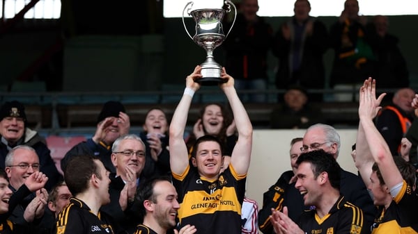 Kieran O'Leary lifts the trophy for the Munster champions