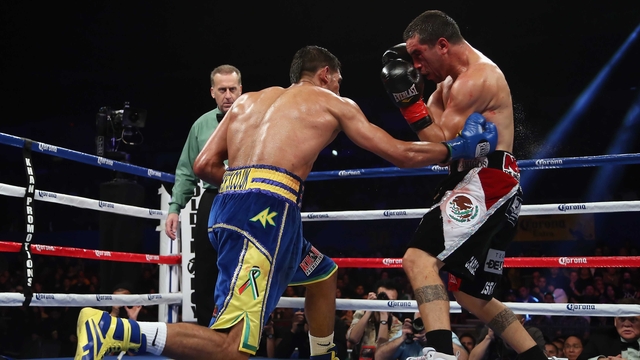 Amir Khan lands a right hand to the body of Carlos Molina