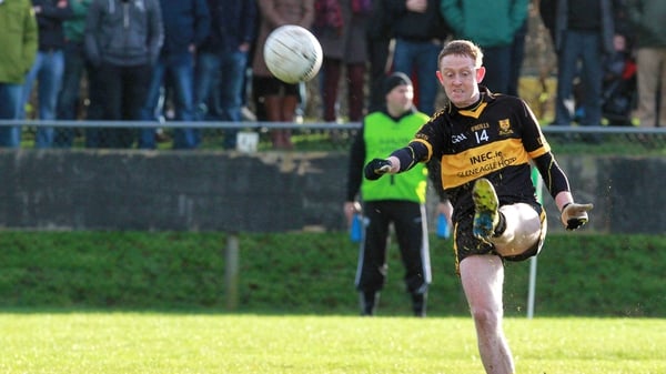 Colm Cooper kicks a point for Dr Crokes