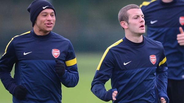 Alex Oxlade-Chamberlain and Jack Wilshere (r) have extended their stays at the Emirates