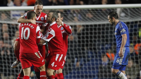QPR players celebrate Shaun Wright-Phillips' goal as Frank Lampard looks dejected
