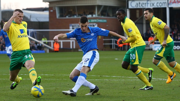 Joe Newell of Peterborough United is closed down by the Norwich City defence