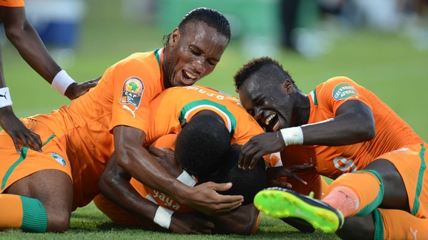 Yaya Toure (m) celebrates scoring a goal with Didier Drogba and Max Gradel