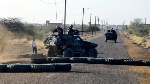 French troops pass a road block on the airport road in Gao earlier this week