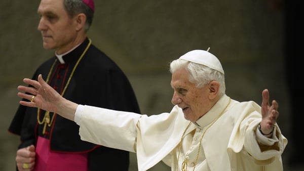 Pope Benedict XVI waves upon arrival for his weekly general audience at the Paul VI hall at the Vatican