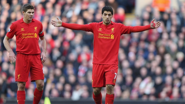 Steven Gerrard (left) is delighted speculation over Luis Suarez's future is over for now