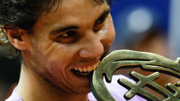 Rafael Nadal celebrates with the Brasil Open trophy