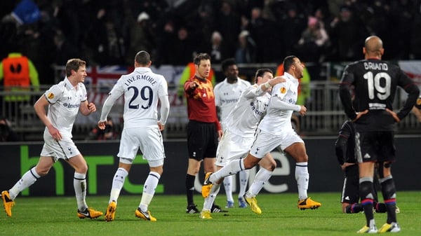 Mousa Dembele wheels away in delight after his stunner against Lyon
