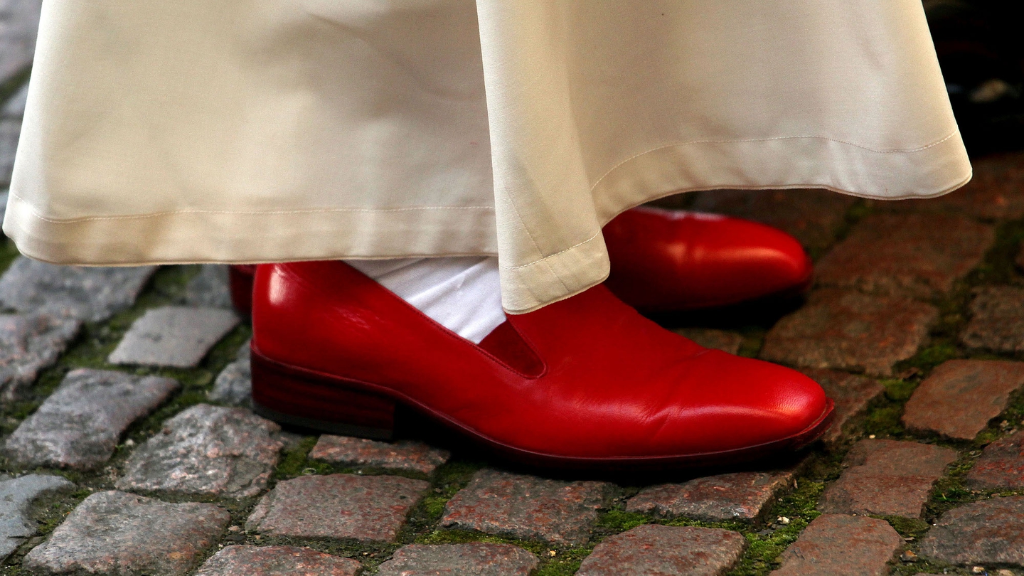 why do popes wear red shoes