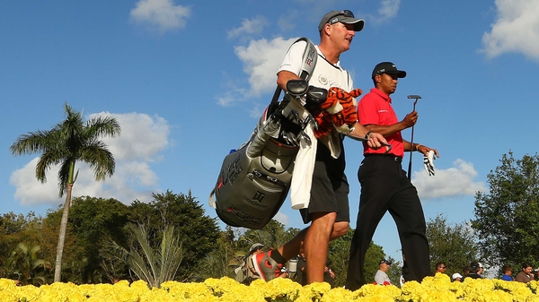 Tiger Woods alongside his caddie Joe LaCava during the final round today