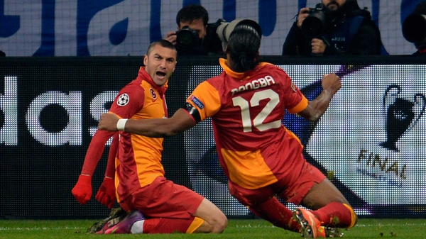 Yilmaz celebrates his goal in the company of Didier Drogba