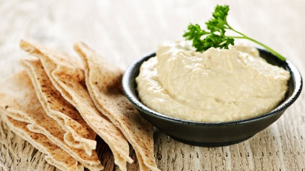 Serve the dip with an extra drizzle of olive oil and sprinkle of coriander on top and the crispy baked pittas on the side.
