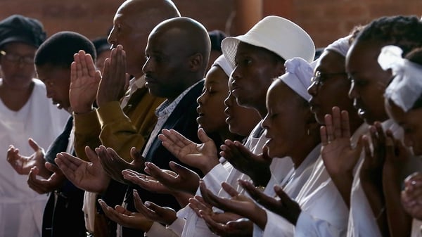 People pray for Nelson Mandela at Easter services in Soweto, South Africa