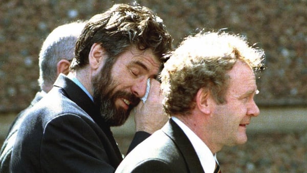 Gerry Adams and Martin McGuinness show the strain of negotiations after agreement was finally reached, 17 hours after the midnight deadline