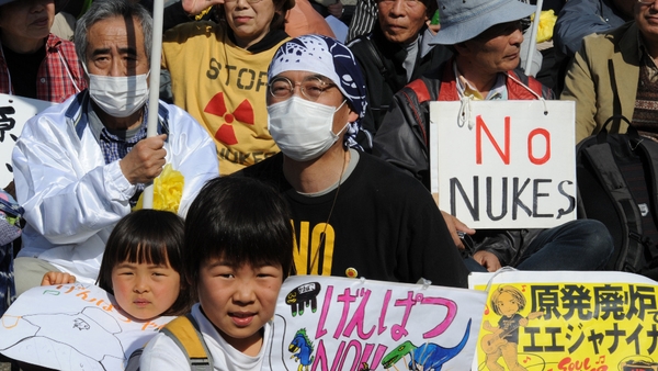 Anti-nuclear protesters hold placards at an anti-nuclear rally in Tokyo in March