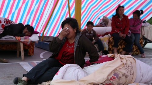 Thousands of survivors spent the night in makeshift tents and shelters