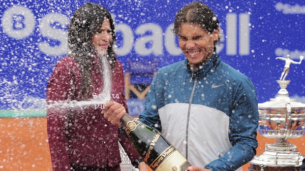 Rafael Nadal sprays Cava as he celebrates victory over his compatriot Nicolas Almagro in the final of the Barcelona Open