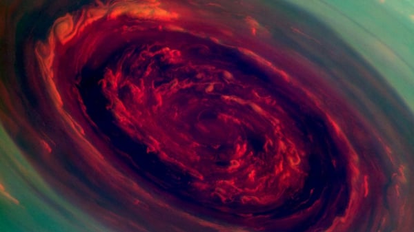 The hurricane is seen on Saturn, in this false-colour photograph released by NASA. Pic: NASA/JPL-Caltech/SSI