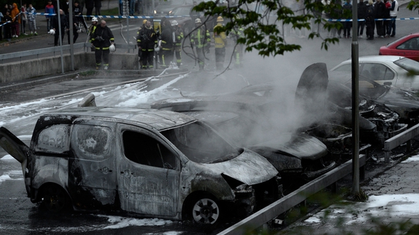 Around 30 cars were set on fire in parts of Stockholm in a fifth night of rioting