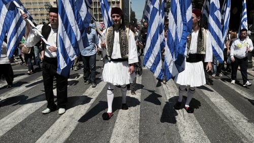 Municipal workers in Athens march towards the Greek Parliament protesting against cuts