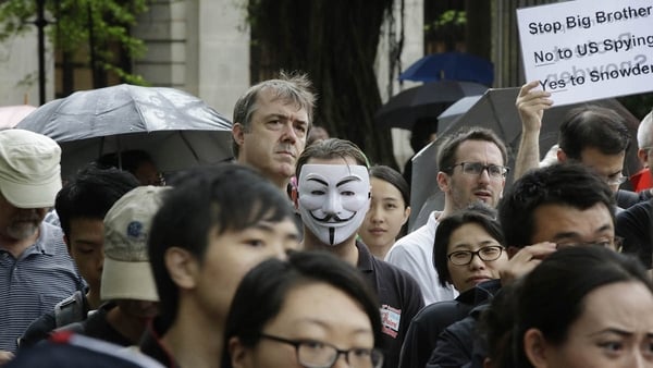 Protesters gather in Charter Garden at the start of the protest rally to support Edward Snowden in Hong Kong