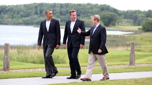 Barack Obama, David Cameron and Enda Kenny walk around Lough Erne