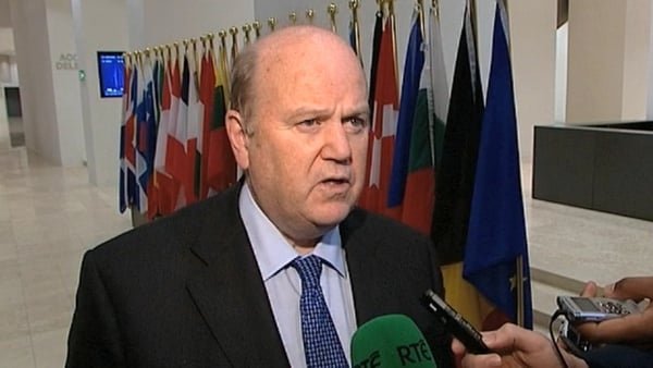 Michael Noonan said there was still a 'long way to go' for legacy bank debt
