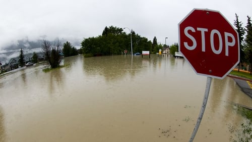 The front entrance to a hospital is overcome with water due to heavy flooding in Canmore, Alberta