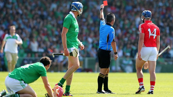 Referee James McGrath shows a red card to Patrick Horgan just before half-time in the Munster final