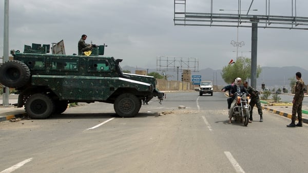 Yemeni soldiers search a motorbike at a checkpoint on a street leading to the US embassy compound in Sanaa