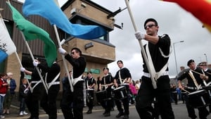 Sinn Féin supporters parade past Castlederg PSNI station earlier this afternoon