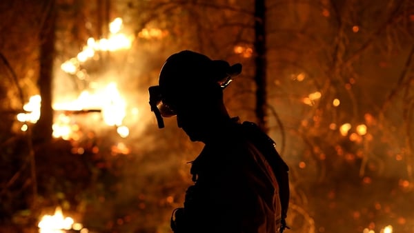 50 large wildfires are burning through the western US putting fire services under enormous strain
