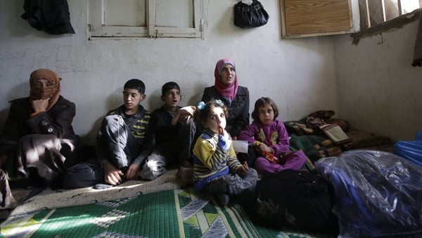 A Syrian refugee family pictured in their accommodation in the Lebanese city of Tripoli