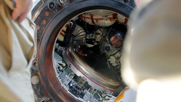 Russian cosmonaut Pavel Vinogradov inside the Soyuz TMA-08M space capsule