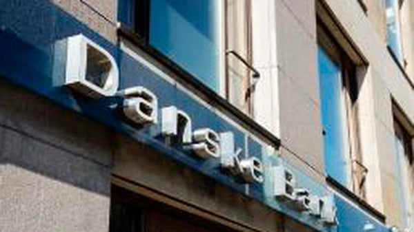 Danske Bank to write down around $1.5 billion of the value of its businesses in Finland, Northern Ireland and Estonia.