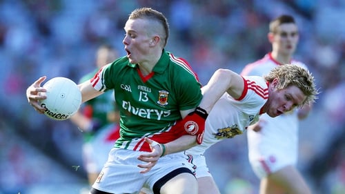 Darragh Doherty of Mayo tussels with Tyrone's Frank Burns