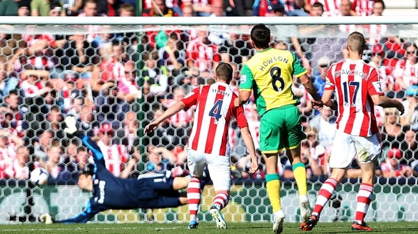 Jonny Howson watches his shot head for the back of the Stoke net