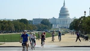 Tourists ride bicycles down the National Mall in Washington, DC after the US Park Police closed off the mall to traffic