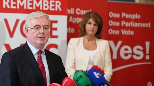 Eamon Gilmore with Joan Burton, who is considered a strong contender for the leadership