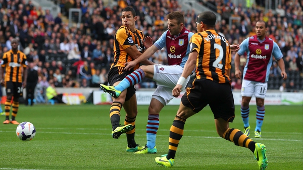 Aston Villa's Andreas Weimann takes a shot at the Hull City goal