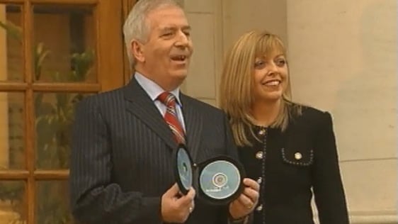 Charlie McCreevy and his wife, Noeleen Halligan, pictured on the steps to Dail Eireann presenting Budget 2004.