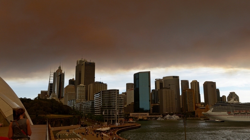 Thick smoke from fires in the Blue Mountains is seen across the Sydney skyline