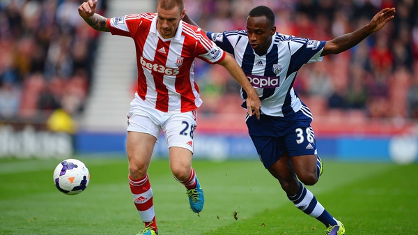 Andy Wilkinson of Stoke City and Saido Berahino of West Brom battle for possession