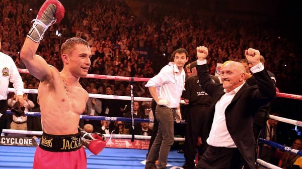 Carl Frampton celebrates with manager Barry McGuigan