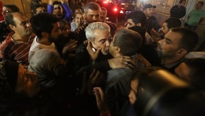 One of the nine Lebanese pilgrims abducted by rebels in Syria is welcomed home in Beirut after after 17 months in captivity