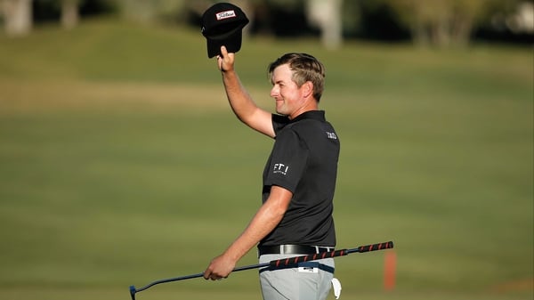 Webb Simpson celebrates a birdie on the 18th on his way to a six-stroke victory