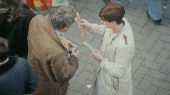 Eamon Ó Muirí buying fireworks on a street in Dublin.